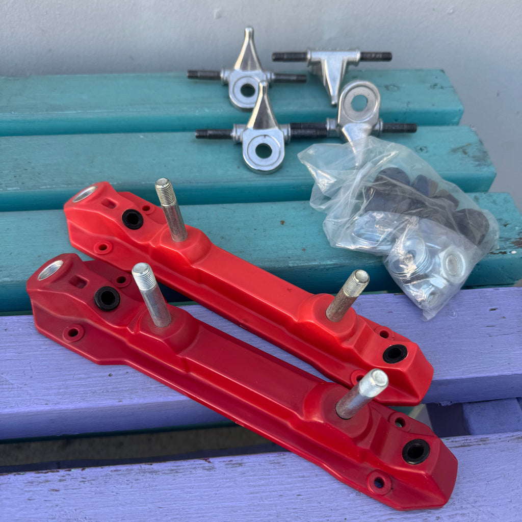Red metal brackets on a blue and gray background