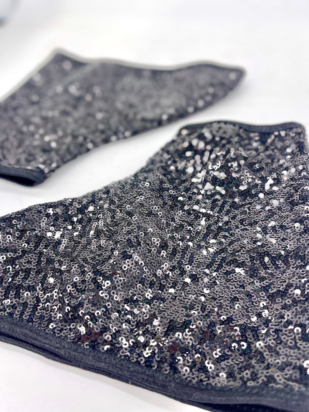 Close up of black sequin covers