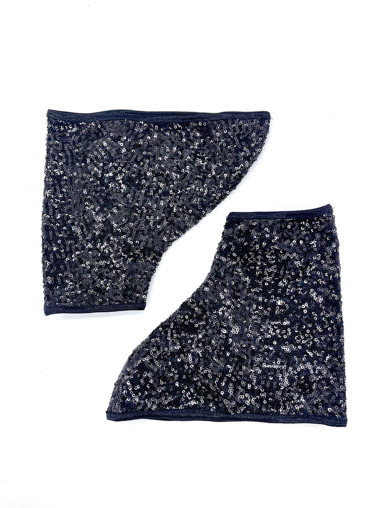 pair of black sequin boot cover laid flat on white surface