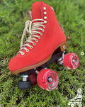 Red roller skate on green grass