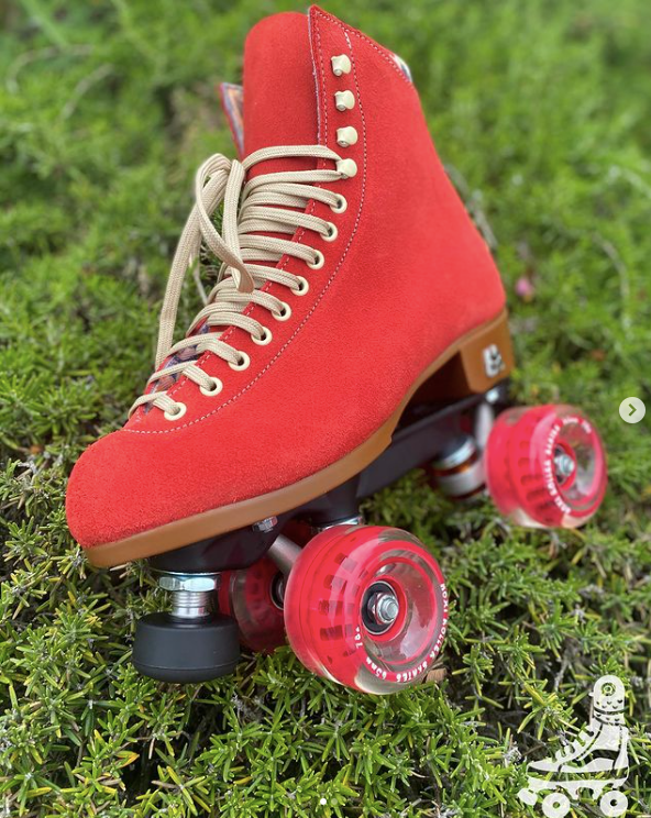 Red roller skate on green grass