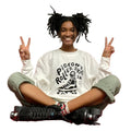 Girl wearing white sweater with black pigeon printed on front