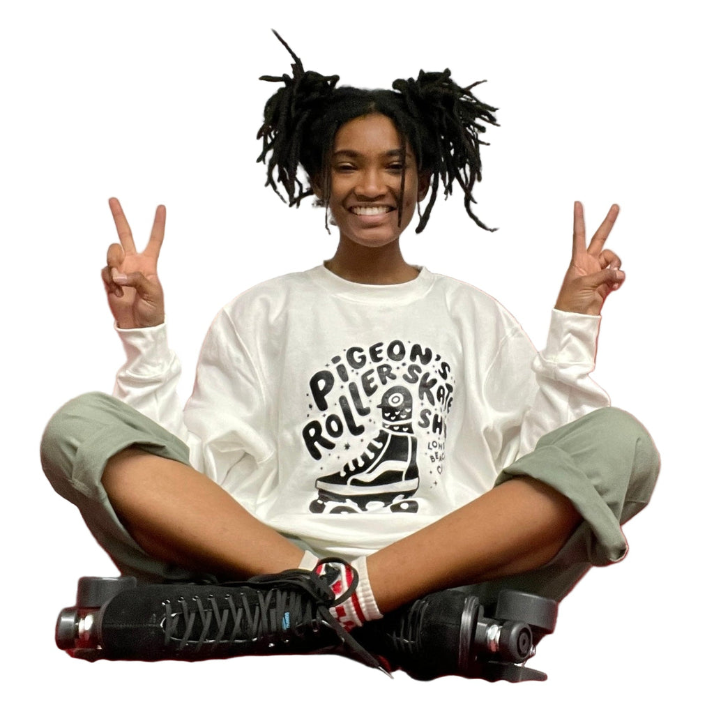 Girl wearing white sweater with black pigeon printed on front